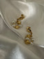 Girasol - Elegant sunflower-shaped gold pearl earrings